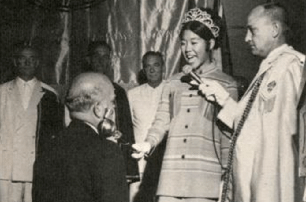 Ralph E. Howland being knighted by festival queen